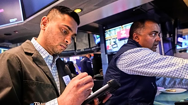 Stocks hold near records as fresh data keeps Fed on track to cut rates