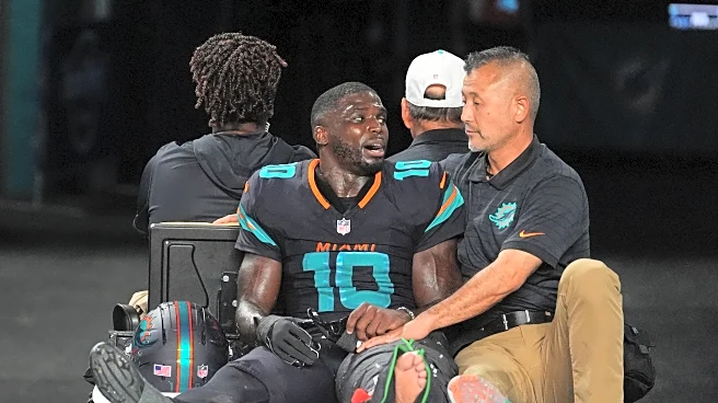 Dolphins' Tyreek Hill carted off field and taken to hospital with dislocated left knee