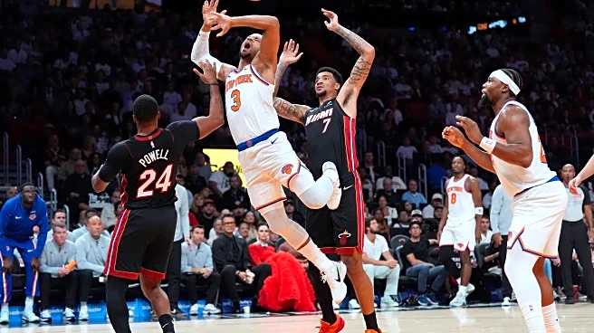 Powell scores 29 as Heat beat Knicks 115-107 in Miami's home opener
