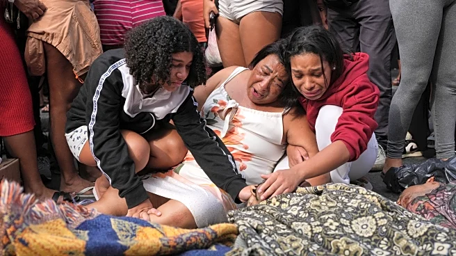 Brazilians in a Rio favela line up bodies after the city's deadliest police raid