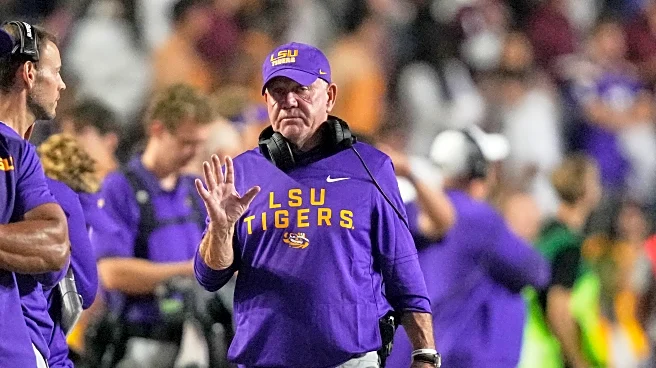 LSU athletic director Scott Woodward resigns, 4 days after the firing of football coach Brian Kelly