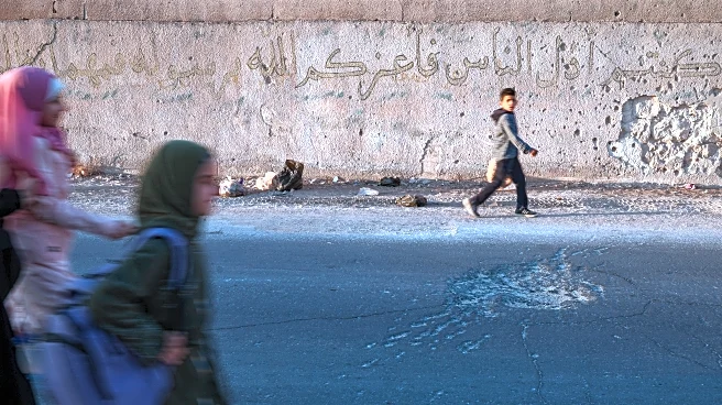 Syrian students return to schools stripped bare by conflict