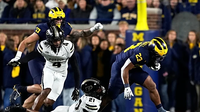 Jordan Marshall runs for 185 yards and 3 TDs to help No. 21 Michigan hold off Purdue for 21-16 win