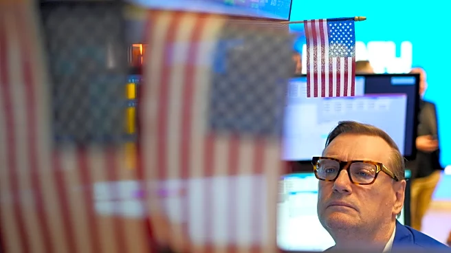 Wall Street dips as markets take in more earnings ahead of Supreme Court hearing on Trump's tariffs