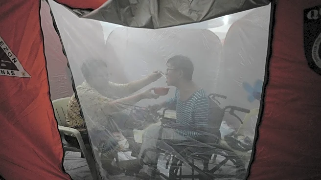 One photo that captures tenderness amid chaos in the Philippines as Typhoon Fung-wong hits