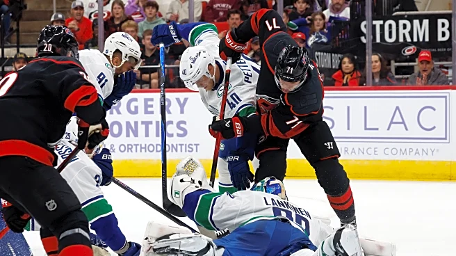 Aho scores in OT to lift Hurricanes to 4-3 win over Canucks
