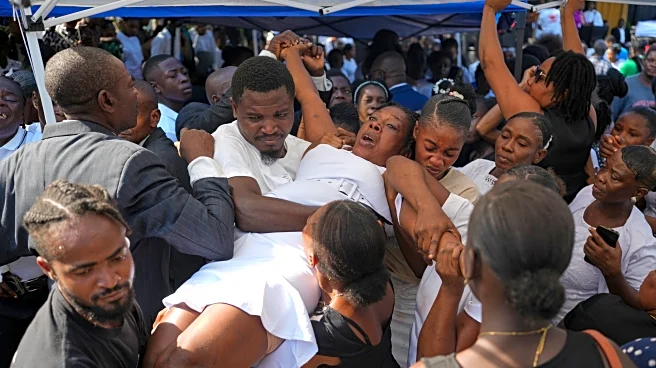 A town in southern Haiti mourns its own as it staggers from Hurricane Melissa's blow