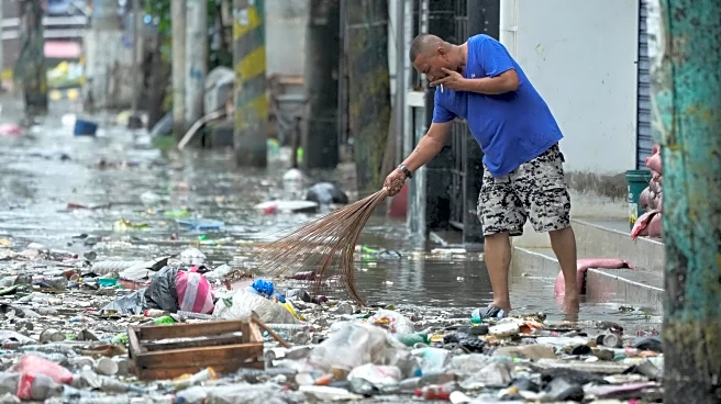 Tens of thousands rally in Manila over corruption scandal that implicates top Philippine officials