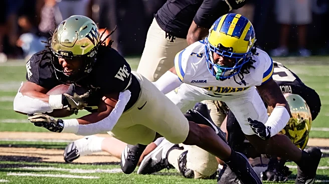 Ashford throws for three TDs as Wake Forest whips Delaware 52-14