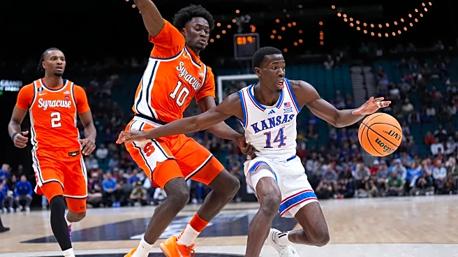 Double-doubles by Tre White and Flory Bidunga help Kansas beat Syracuse 71-60 at Players Era tourney