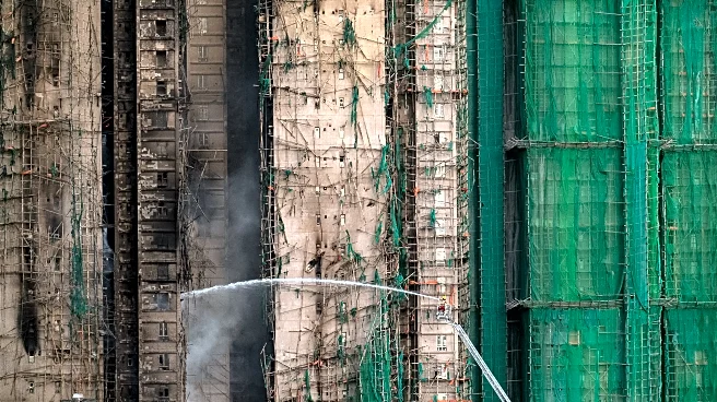 At least 55 dead as Hong Kong firefighters battle burning towers for a second day