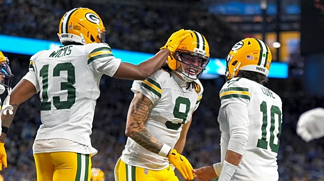 Love matches career high with 4 TD passes, lifting Packers to 31-24 win over Lions