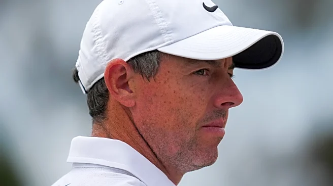 Rory McIlroy's late birdie burst means he'll be playing on the weekend at the Australian Open