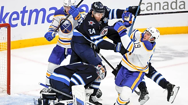 Eric Comrie makes 34 saves in Jets' 4-1 victory over the Sabres