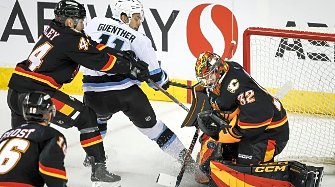 Wolf has 28 saves for 5th career shutout as Flames beat Mammoth 2-0