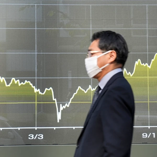 Asian shares slip after Wall Street pulls back from its record heights