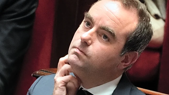 French lawmakers narrowly approve health care budget, suspending Macron's flagship pension reform