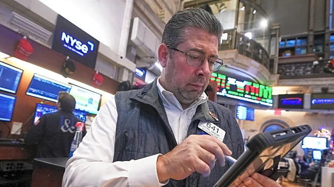 Wall Street ticks lower in early trading as markets await call by a divided Federal Reserve