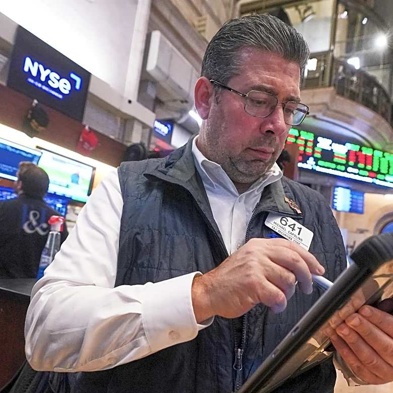 Wall Street ticks lower ahead of call by a divided Federal Reserve