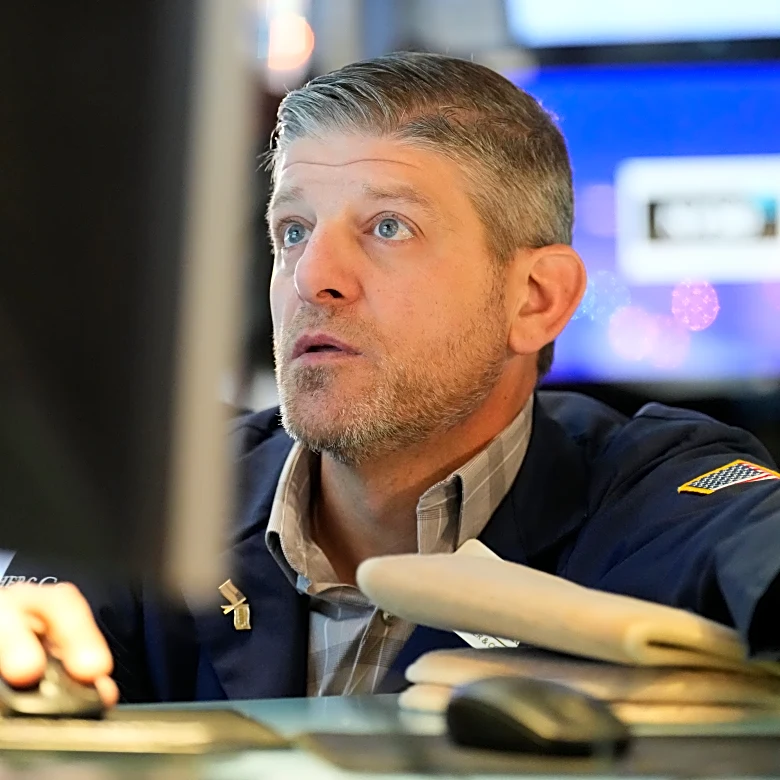 Wall Street is quiet as it waits for the Federal Reserve's announcement in the afternoon