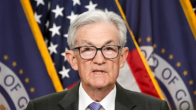 Federal Reserve cuts key rate, sees healthier economy next year