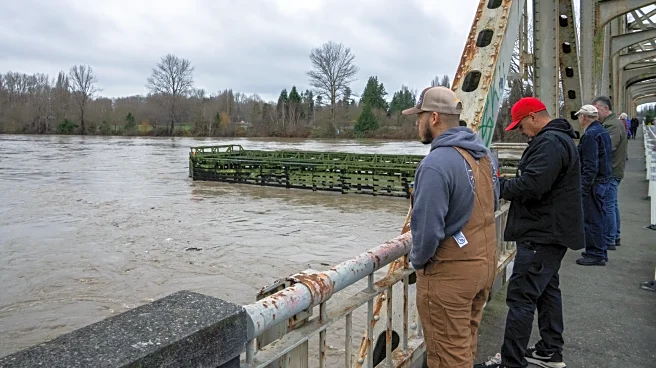 Tens of thousands ordered to flee flooding after torrential rain in Pacific Northwest
