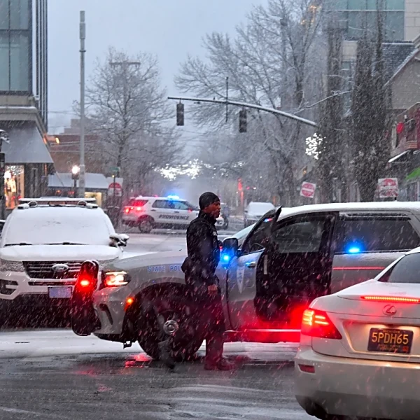 The Latest: A person is in custody after deadly Brown University shooting leaves 2 dead, 9 wounded