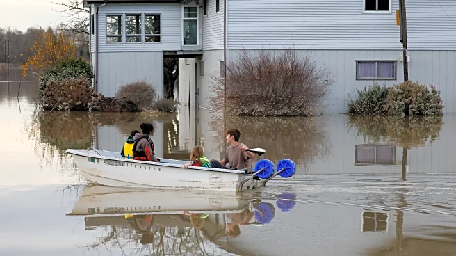 Crews use sandbags to shore up breach in levee near Seattle after failure prompts flood warning