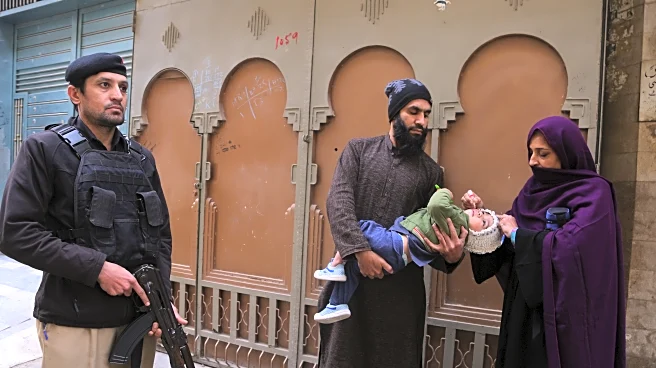 Suspected militants kill 2, including a police officer guarding polio team in northwestern Pakistan