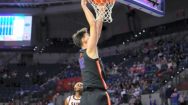 World's tallest teen, Florida's Olivier Rioux, delivers emphatic dunk for first college field goal