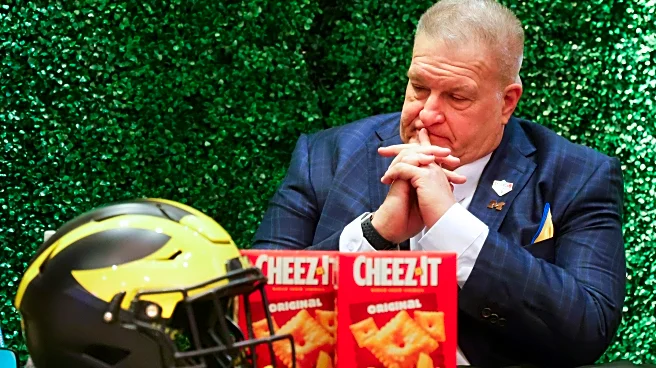 Michigan interim coach Biff Poggi wants to keep the job beyond bowl game and 'fix this program'