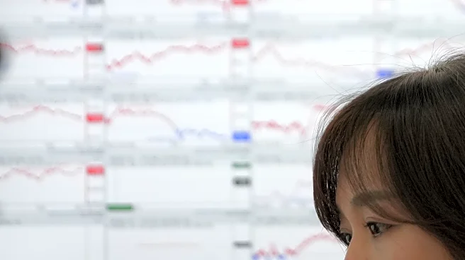 Asian shares are mixed, while gold and silver hit record highs