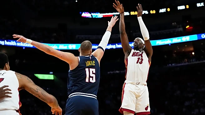 Jokic gets hurt late in 1st half, Heat pull away from there to top Nuggets
