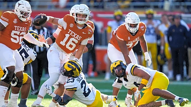 Manning uses arm and legs to lead No. 14 Texas to a 41-27 Citrus Bowl win over No. 18 Michigan