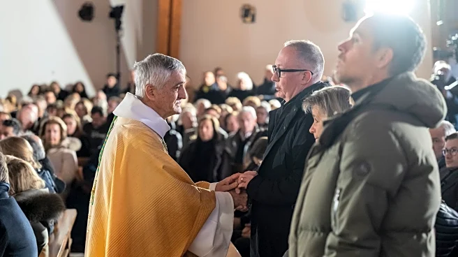 A mother says goodbye to her son as Swiss community grieves after deadly fire