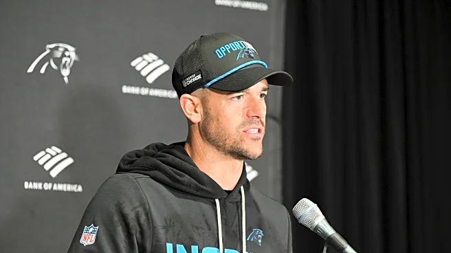 Dave Canales and the Panthers celebrate Falcons' win that gave Carolina the NFC South title