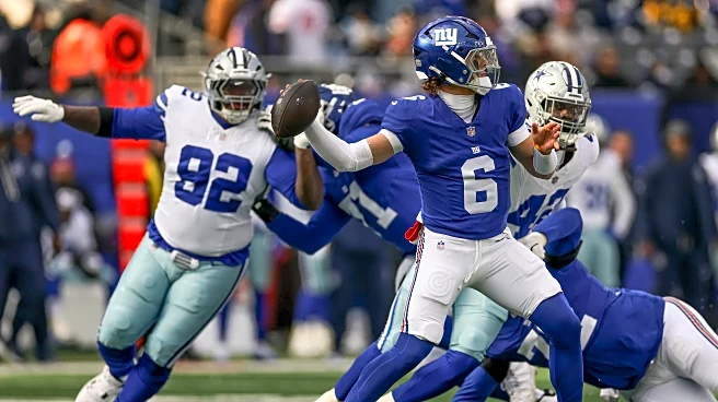 Owner John Mara gets a game ball after Giants beat the Cowboys 34-17 in season finale