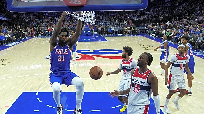 Embiid, George lead 76ers to a 131-110 win over Wizards, who acquire Trae Young in trade with Hawks