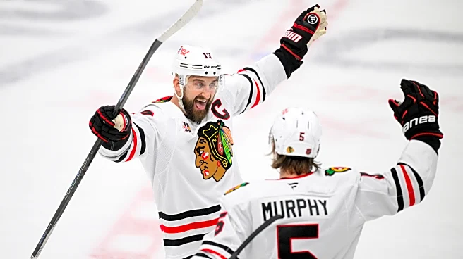 Moore and Murphy help the Blackhawks beat the Blues 7-3 for their 4th straight win