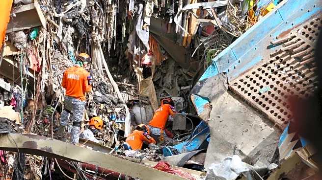 Filipino rescuers detect 'signs of life' in garbage avalanche that killed 4 and left dozens missing