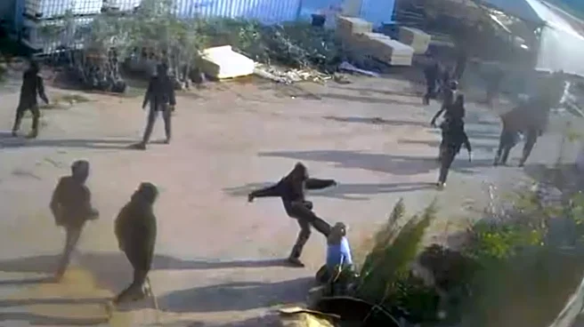 Video shows armed men beating a Palestinian in the Israeli-occupied West Bank