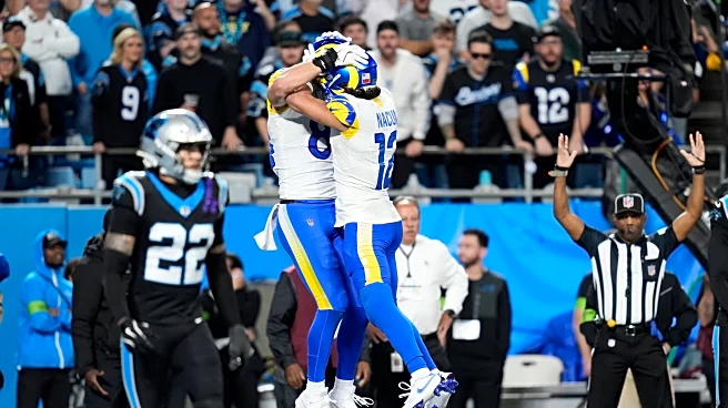 Stafford's late TD pass to Parkinson lifts the Rams past the Panthers 34-31 in tense playoff opener
