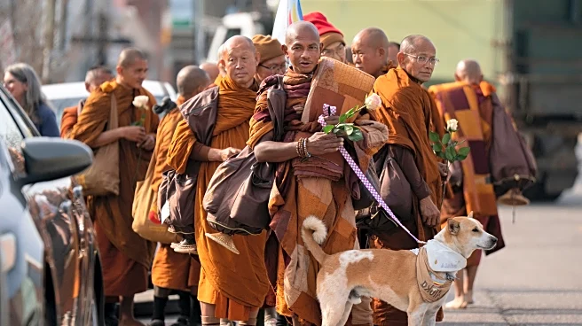 Buddhist monks and their dog captivate Americans while walking for peace
