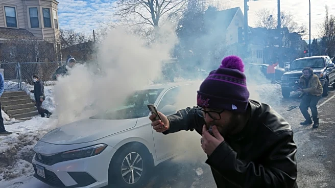 Crowd yells 'cowards!' after federal agents crash into a car and fire tear gas in Minneapolis