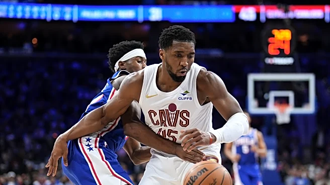 Mitchell has 35 points to power Cavs past 76ers 133-107 but Garland exits with foot injury