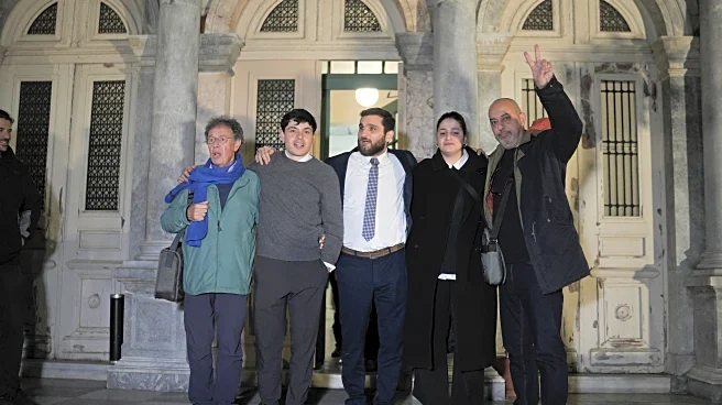 Syrian swimmer among activists cleared by Greek court of aiding migrant rescues