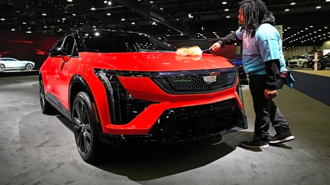 At Detroit auto show, spotlight dims for EVs