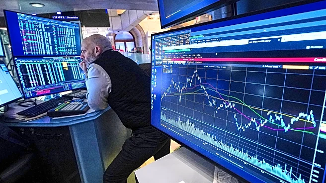 Stocks waver on Wall Street and remain near records