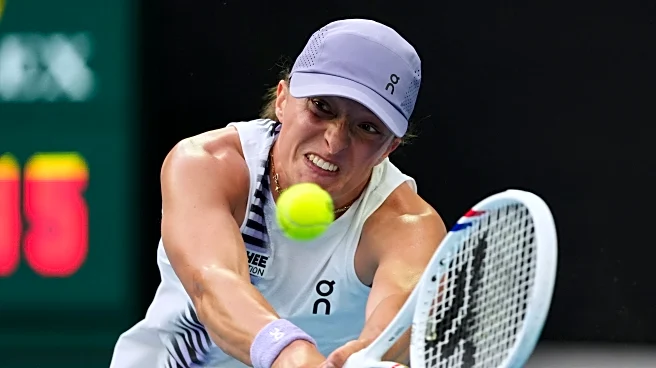 Świątek overcomes rust to advance in Australian Open. Djokovic racks up more records