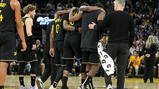 Warriors star Jimmy Butler goes down with right knee injury in win over Heat